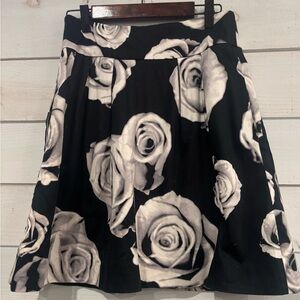 White House Black Market Floral Black and Gray pleated Skirt with pockets .
